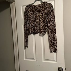 Long sleeve sheer leopard print mesh crop top.